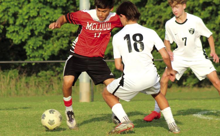 McLoud's Kristian Lujan maneuvers around the Crossings Christian defense during the April 16 home soccer match. The Redskins lost 0-7. Photos by Natasha Dunagan, Countywide & Sun