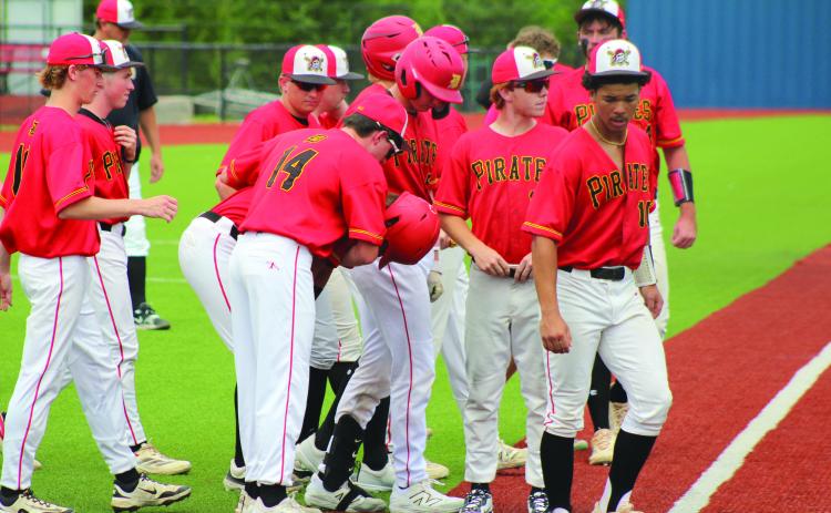 Dale junior Carver Crowson (#14) comforts senior Jett Higdon who was the last batter during the Class 2A State Baseball Tournament Quarterfinals with Oktaha held at Seminole State College on May 15. The Pirates lost, 6-10, but they end their season with a record of 28-5. Photos by Natasha Dunagan, Countywide & Sun