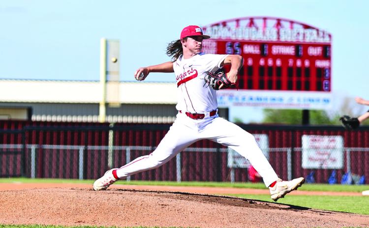 North Rock Creek’s Landon Kelough puts everything into the pitch. NRC Beat Henryett 10-0 and Kelough was the winning pitcher.
