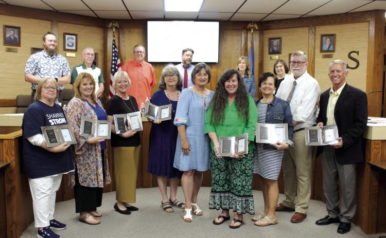 Retirees from Shawnee Public Schools were honored with a reception before the Shawnee Board of Education regular meeting on May 14, and they also received a clock. Shown, from left, are Debra Watson, Beth Mills, Angela Lindsay, Terri Mastin, Dana Boyer, Mary Cash, Laura Brandherm, Randy Lauderdale and Ray Shaffer. Countywide & Sun/Natasha Dunagan