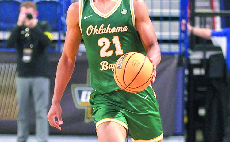 Jackson Greene takes the ball up court in the victorious quarterfinal round of the GAC men’s squad. Photo Provided