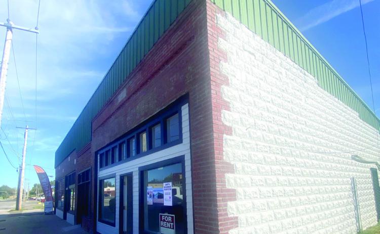 The most westward stop on the Empty Buildings Tour was the former Greens Corner, now remodeled and ready for new business. One of the two available rentals in this location was leased during the tour.