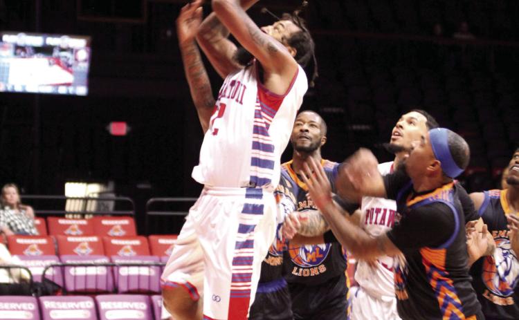 Potawatomi Fire center Johnny McCants puts up a rebound during the Free Exhibition game against the Memphis Lions on Feb. 28. The Fire begin their season tonight (March 5) at 7 pm at the FireLake Arena against the new TBL team, the ADS Sentinels. Photos by Natasha Dunagan, Countywide &amp; Sun