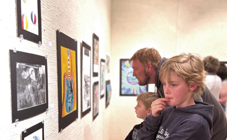 Gerrer Museum of Art. The annual exhibition will be on display from Mar. 1-30 and the opening reception will be on Mar. 2 at 5 pm. Photo provided by MGMoA Visitors tour the Annual High School Juried Art Exhibition at the Mabee-