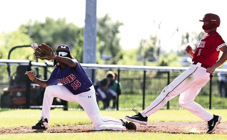 Pictured left, North Rock Creek’s Gus Snodgrass beats the throw to arrive safe at third base. Photo courtesy of Gowin Photography