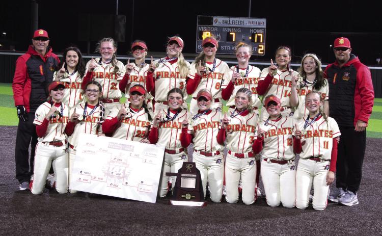 The Dale Lady Pirates and their coaches, Andy Powell, far left, and Bryce Clemmons, pose after winning the Class 4A State Slow Pitch State Championship at FireLake Ball Fields on May 5. The Lady Pirates narrowly beat Silo, 18-17, as well as Coalgate, 14-5, and Howe, 15-0. They end their season with a record of 39-4. Photos by Natasha Dunagan, Countywide &amp; Sun