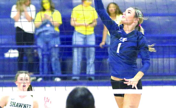 Shawnee senior Ally Fichtner gets one of her eight kills during the Lady Wolves’ Regional Championship on Oct. 12. Photos Courtesy of Kent Bush