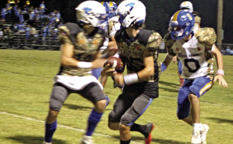 Bethel freshman Bryce Tapley tries to gain yardage along the sideline as a Holdenville player prepares to tackle him during the district home game against Holdenville on Military Night, Oct. 14, 2021. Countywide & Sun/Natasha Dunagan
