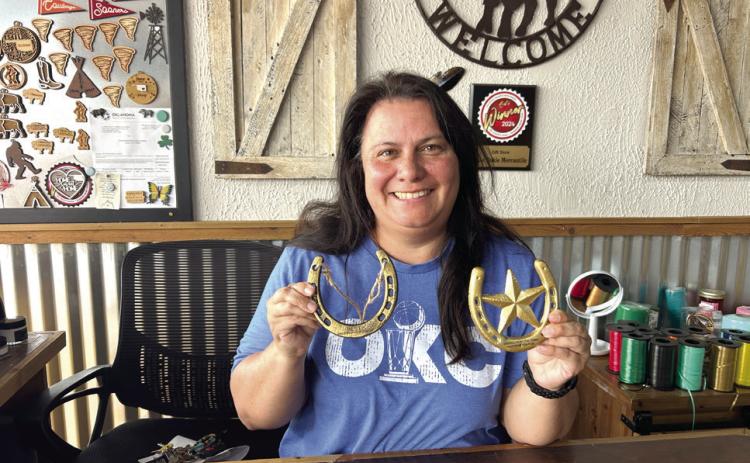 Okie Dokie Mercantile won the Paint the Town Western IFYR Best Western Window Display and was chosen as the Overall Paint the Town Western Champion. Pictured holding the Golden Horseshoe awards is owner Christina Hernandez. Suzie Campbell, Countywide &amp; Sun