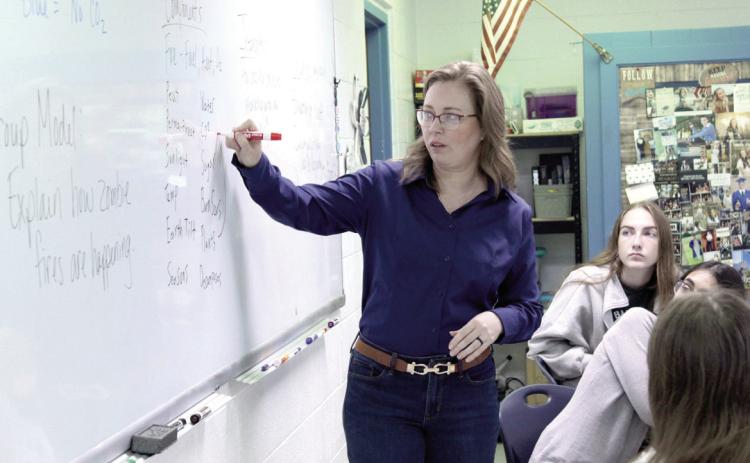 Bethel High School Biology teacher Vanessa Jones speaks about connections between the components for zombie fires, discussed and written by her Honors Biology students, on April 23. Jones is an Oklahoma Teacher of the Year Top-10 Finalist. Natasha Dunagan, Countywide & Sun