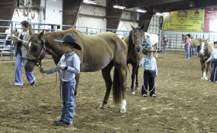 Ransom Parsons, 9, and Raykin Parsons, 4, both of Earlsboro, show in the Senior Geldings division of the Pottawatomie County Free Fair Horse Show on Sept. 6. Ransom placed fifth with his horse Cowboy, out of 11 entries. The judge for the horse show was Jaclyn Sturgeon.