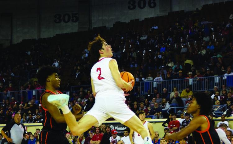 David King jumps for two on Mar. 8 in the Semifinals at the State Fair Arena. North Rock Creek took the loss 38-74 and Douglass went on to win the 4A Championship title. Countywide &amp; Sun/Julie Talton
