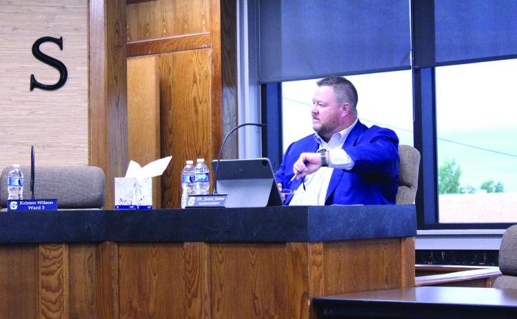 Shawnee Public Schools Superintendent Dr. Jason James poses a question about his smart watch while speaking on the new "bell-to-bell no personal wireless electronic device" policy during the SPS Board of Education meeting on June 30. Natasha Dunagan, Countywide & Sun