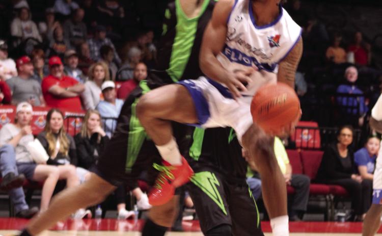 Potawatomi Fire shooting guard Jaylen Mahone aims for the basket in the home game with the Little Rock Lightning on April 19. The Fire won, 125-105, making their record 11-0. Countywide & Sun/Natasha Dunagan