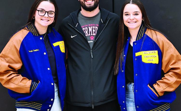North Rock Creek's Sarah and Morgan Campbell were presented All-State Jackets for for fast pitch softball by Coach Griffen.