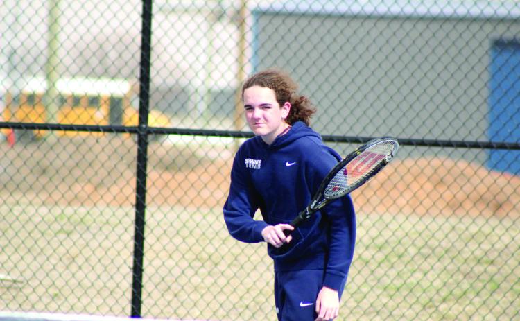 Shawnee freshman Sammy Thomas keeps his eye on the ball after returning it during the Shawnee Invitational on March 14. Thomas is on the extra #2 Doubles team with Brandon Holter. Natasha Dunagan, Countywide & Sun