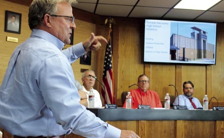 Shawnee Public Schools Executive Director of Operations Ron Stearns gives a presentation on the progress of tornado recovery projects to the Shawnee Board of Education on Aug. 5. He said they will have the new digital scoreboard installed at Jim Thorpe Stadium on Aug. 22, and they will have as much done on the stadium as possible before the first football game on Sept. 13. The press box may not be done by then, but there will be a rendering of it on display. Countywide & Sun/ Natasha Dunagan