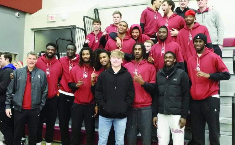 Dayton Forsythe (front, center, black jacket) is joined by OU Men’s Basketball Head Coach Porter Moser and members of the OU team, Saturday, Feb. 22. During halftime of the Dale districts game, Forsythe was honored with the retirement of his number. See the story and additional photos on page B1. Countywide & Sun/Suzie Campbell