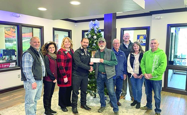 BancFirst presented a check to the McLoud Historical Society in support of fundraising efforts to further the mission of the museum. Pictured above (from left) are Dean Hill Brenda Hill, Christina Smiley, Jacob Sestak, James Metcalf, Bruce Ferrell, Casey Bell, Sylvia Metcalf, and Don Kuhn. Photo provided