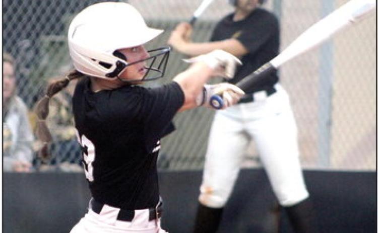 Tecumseh’s Taylor Gage hits a double in the second inning of the second home game on April 4.