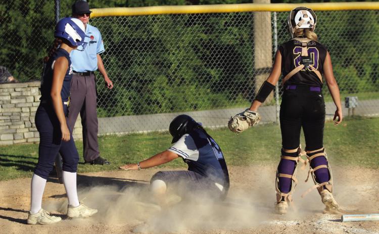Asher freshman Raina Timms slides into home during the third inning of the home game against Community Christian School on Sept. 5. The Lady Indians won, 10-2. Countywide &amp; Sun/Natasha Dunagan