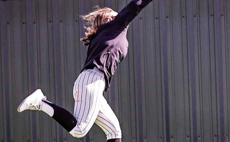 NRC's Jaden Clifton makes a running grab for the out in the first game of their season.