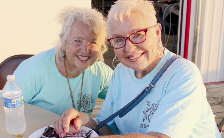 IFYR volunteers Sue Nelson and Linda Brown pose together on the last night of the rodeo, July 12. Nelson has volunteered since it was the National High School Rodeo Association, which was in Shawnee for three years over 30 years ago. Brown estimates that it has been 29 years for her. Countywide & Sun/Natasha Dunagan