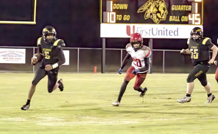 Tecumseh senior Sylis Grayson finds his path down the right side of the field during the Oct. 15 home game against Western Heights. Coached by Mike Montano, the Savages secured their first win of the season, 34-14. Photos by Natasha Dunagan, Countywide & Sun