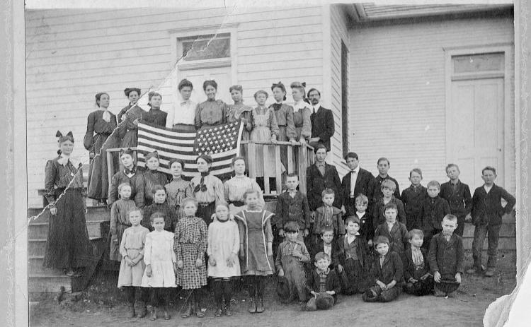 The New Hope School class of 1903 pose in front of the first school building, which opened in 1896 and burned down in 1936.